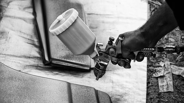 Paint spray gun in use